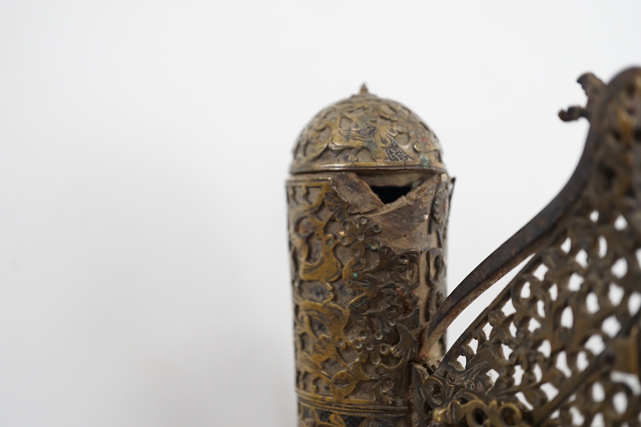 An 18th century Persian pierced brass powder / shot flask, 13cm